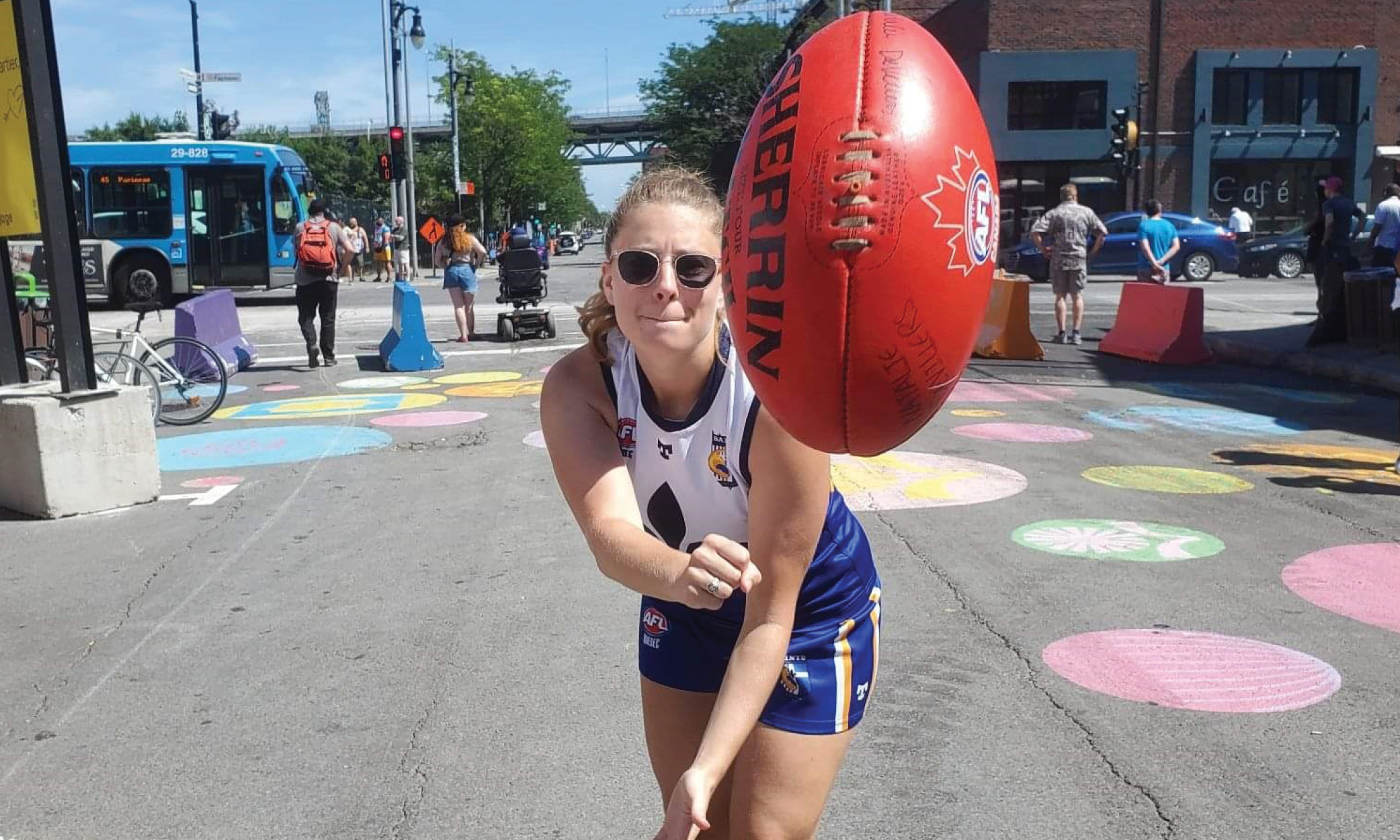 Natalie Devillers throwing AFL ball